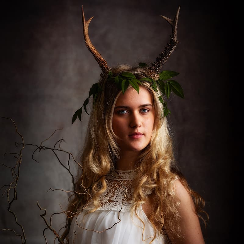 Young woman wearing deer antlers