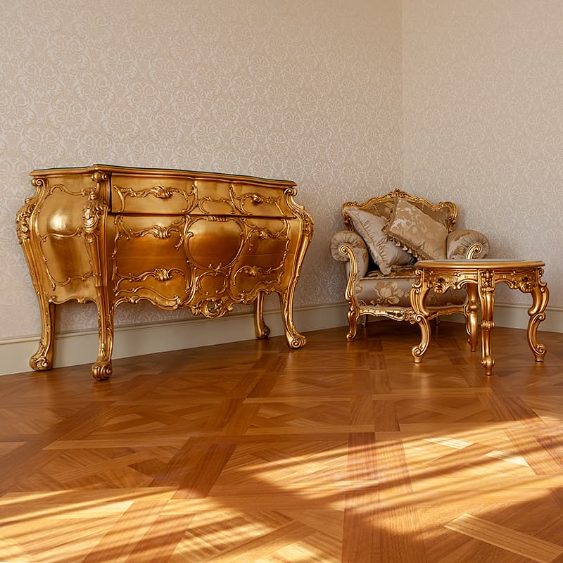 Gold chest of drawers and chair with small table on a modern light wood floor.
