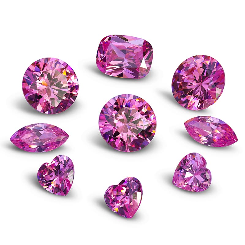  Nine pink glass jewels placed ina circle.